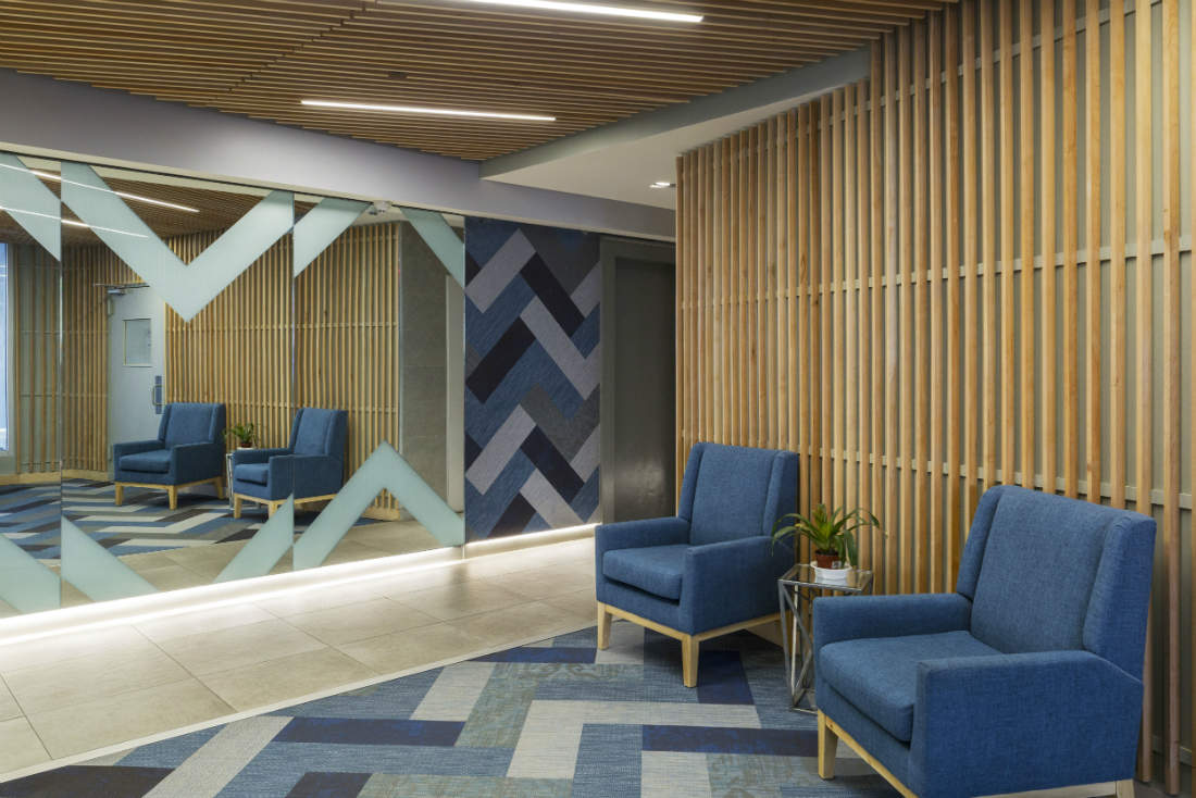 Blue Chairs Waiting Area Pattern Rug Mirror Wall
